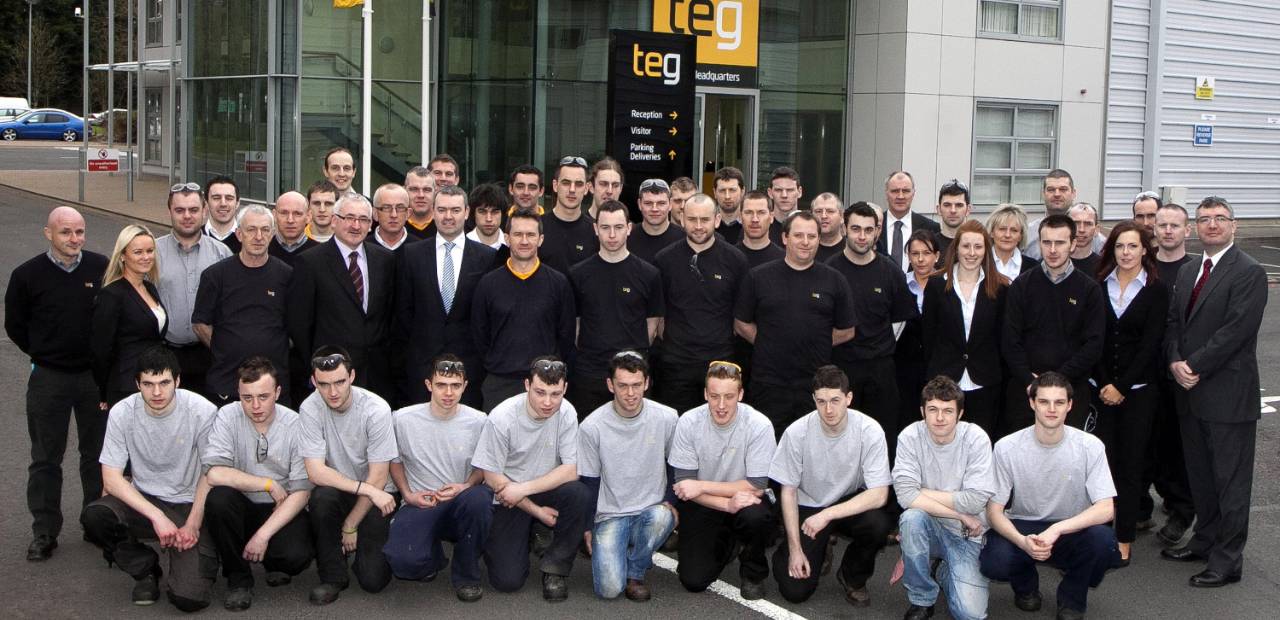 TEG staff in front of HQ